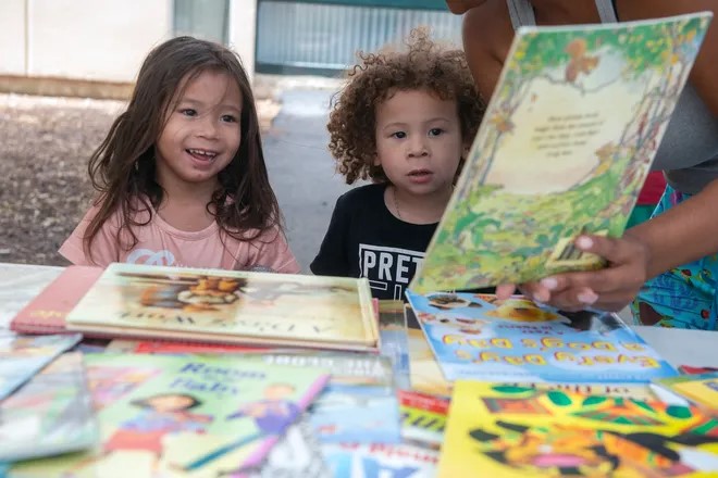 Isla and Isai Picking out childrens books through Ready to Read